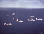 B-24 Liberators of 458th Bomb Group are escorted by P-51 Mustangs of the 486th Fighter Squadron, 1944-45. Photo 1 of 2.