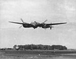F-5C “All On View” of the 22nd Photographic Recon Squadron makes a low level pass over RAF Mount Farm, Dorchester, England, UK, 1943-45