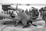 F6F-3 Hellcat of Navy Fighting Squadron 33 after dropping into a bomb crater at the Barakoma airstrip, Vella Lavella, Solomons, late 1943. Fighting 33 was one of the few land based fighter squadrons, a role later taken up by Marine squadrons.