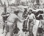 Marine Col Chesty Puller greets a Navy Admiral at the 1st Marines command post on Peleliu, Sep 18 1944.