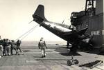 An FM-2 Wildcat after a very hard landing aboard the training aircraft carrier USS Sable on Lake Michigan, United States, 1943-45. Note the broken tailhook, the missing tail wheel, and the mangled wingtip.