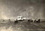 Deck crews aboard the training aircraft carrier USS Sable man lines to right an FM-2 Wildcat that had nosed completely over. Lake Michigan, United States, 1943-45. Photo 1 of 3.