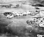 Southeast Loch of Peal Harbor Naval Base, Oahu, Hawaii, Oct 13 1941. The Submarine Base finger piers (right), Supply Depot (center), last 2 berths of Battleship Row (upper left), and East Loch anchorage (upper right).
