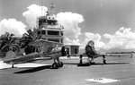 Boeing N2S-5 Stearman and North American FJ-4 Fury in front of the Barbers Point Tower, 1961