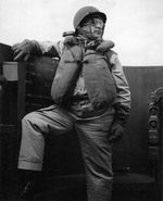 Captain Dixie Kiefer in battle dress on the command bridge of USS Ticonderoga during the launching of aircraft against Luzon, Philippines, Nov 6, 1944.