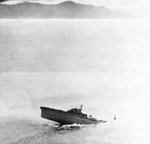 Japanese cruiser Kashii sinking by the stern after being attacked by United States carrier aircraft off the coast of French Indochina (Vietnam) north of Qui Nhon, Jan 12, 1945. Photo 5 of 9