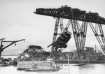 Floating crane YD-25 raising USS Arizona’s foremast during salvage operations in Pearl Harbor, Oahu, Hawaii, circa 1943. Note the guns of Arizona