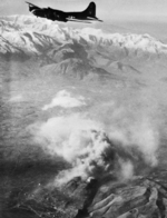 B-17F Fortress flying over Monte Cassino as smoke rises from the abbey, Feb 15, 1944.