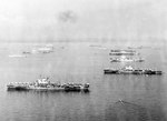 British aircraft carriers Victorious, Formidable, Unicorn, Indefatigable, and Indomitable, comprising the carrier component of Task Force 57, at anchor in Leyte Gulf, Philippines, Apr 1945.