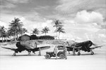 USMC LTs Don Wilson & Gene Youngs of VMF-122 run up their F4U-1D Corsairs prior to receiving an arriving dignitary on Peleliu, Western Caroline Islands, Pacific, Aug 1945.
