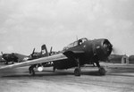 TBM-3E Avenger at NAS Squantum, Massachusetts, United States, with partially folded wings, 1947. The white canister mounted under the right wing is a radar pod.