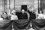 The British Royal family and Prime Minister Winston Churchill responding to the cheering crowds on the surrender of Germany, Buckingham Palace balcony, London, England, United Kingdom, May 8, 1945.