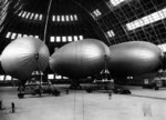 Three US Navy K-class airships from Airship Patrol Squadron ZP-11 inside Hangar One at NAS South Weymouth, Massachusetts, United States, Dec 6, 1942.
