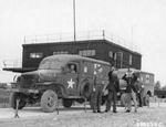 WC-27 ambulances of the 70th Service Group await the return of the 386th Bomb Group’s B-26 Marauders, RAF Great Dunmow, Essex, England, United Kingdom, Oct 5, 1943