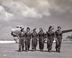 A group of US Navy flight nurses walking away from a Douglas R5D Skymaster aircraft, Guam, Marianas, Apr 1945