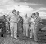 Secretary of the Navy Frank Knox, left, touring Guadalcanal with Adm Nimitz, Adm Halsey, and Army Gen J Lawton Collins, Jan 21, 1943. Apparently no one thought to tell Knox his helmet was on backwards.