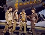 Gunners of the 385th Bomb Group pose in front of B-17F Fortress "Mission Belle" and listen to a word from the Chaplain, James O. Kincannon (“Chaplain Jim”), at Great Ashfield Air Field, England, UK, late 1944.