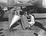 A "patient" being prepared for transport during a drill, 1944. The aircraft is an F-5B Lightning "Lucky!" likely with the 28th Photo Recon Sq fitted with two drop tanks modified for use in high speed medevac operations