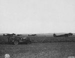 US Army personnel observing dummy Junkers Ju-88 bombers left behind at the airfield at Épinay, France, 2 Sep 1944.