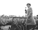 Field Marshal Bernard Montgomery standing in a Jeep while addressing American troops in Devon, England, United Kingdom, 15 Jan 1945. The bare-headed soldiers suggest this was a worship or memorial service.