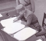 Xu Yongchang signing the surrender document on behalf of China aboard USS Missouri, Tokyo Bay, Japan, 2 Sep 1945, photo 5 of 5