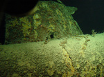 Underwater image of the Japanese Type A midget submarine sunk by USS Ward as the first casualty of the Pearl Harbor Attack, 7 Dec 1941. Note shell hole. 28 Aug 2002 photo by Hawaii Undersea Research Laboratory (HURL).