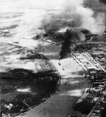USS Essex strike photo showing shipping under attack in Saigon Harbor, French Indochina (Ho Chi Minh City, Vietnam), 12 Jan 1945.