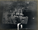 Damage to USS Intrepid’s starboard rudder being examined in Pearl Harbor Drydock #1, 26 Feb 1944. The damage was done by an aerial torpedo on 17 Feb 1944 off Truk.