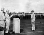 US Navy Admiral William Halsey presenting Vice-Admiral John McCain with the Navy Cross on the flight deck of USS Hancock at anchor in the Ulithi Lagoon, Caroline Islands, 30 Nov 1944.