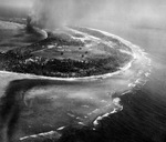 Strike photo of Kwajalein, Marshall Islands taken by aircraft from USS Enterprise, 30 Jan 1944. Note the Kwajalein radio complex in the clearing in the foreground that was a key Japanese listening post in the Pacific.