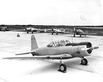 Secondary training aircraft at Naval Air Station at Corpus Christi, Texas, 1940. Foreground: Vultee SNV-1 Valiant; Background: Beech SNB-1 Kansan and two North American Texans, one Navy SNJ and one Army AT-6