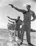 Naval Aviation Cadets from the Naval Air Station at Corpus Christi at the pistol range with Colt M1911-A1 .45 caliber pistols, Corpus Christi, Texas, United States, circa 1941.