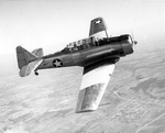 North American SNJ-4 Texan advanced trainer in flight over Naval Air Station at Corpus Christi, Texas, United States, Mar 1943
