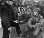 War Correspondent Ernie Pyle speaking to Lieutenant John Mason Brown, northern France, 15 Jun 1944