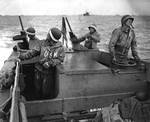 US Navy sailors manning an LCVP in the English Channel, mid June 1944. Note the LCVP’s plywood construction.