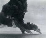 Strike photo from USS Lexington (Essex-class) aircraft showing Japanese shipping burning furiously off Cape Padaran, French Indochina (Vietnam), 12 Jan 1945.
