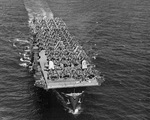 Replacement aircraft for Espiritu Santo crowd the flight deck of the Escort Carrier USS Kwajalein as she steams from San Pedro, California, United States, 19 Jul 1944