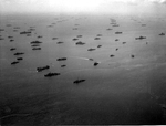 US Navy ships at anchor in the Ulithi Lagoon, Caroline Islands, early Dec 1944. Note that this is a reverse angle and distant view of the ships in the famous “Murderers’ Row” photograph but a day or two earlier.