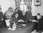 Chief Air Marshall Sir Arthur Tedder and LtGen Carl Spaatz in the office of Marshall Georgy Zhukov before the German surrender was signed at Zhukov’s Headquarters at Karlshorst, Berlin, Germany, 7 May 1945