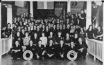 Group portrait of the crew of USS Burrfish, 1943; note commanding officer Lt Cdr William Beckwith Perkins, Jr. front row center and Page Newman Perkins (née Rudd) behind him