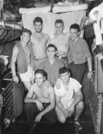 US Navy submariners, 1943-1945; they were likely crewmembers of USS Billfish, USS Bowfin, or USS Burrfish; note Frederick B. Meek, Jr. in rear row with cigarette