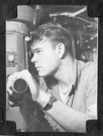 Crewman at the periscope of USS Burrfish, 1943-1945