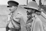 Abyssinian leader Haile Selassie with a British interpreter during an inspection of an airfield in eastern Africa, 19 Feb 1941.