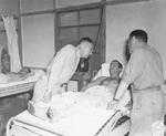 Lieutenant General Joseph Stilwell speaking to Private 1st Class John P. Belba at US Army 20th General Hospital, Assam, India, 15 Jul 1944; also present was commanding officer and doctor Colonel I. S. Ravdin