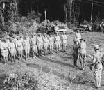 Lieutenant General Joseph Stilwell awarding the Silver Star medal to a Chinese soldier, Hukawng Valley, northern Burma, Mar 1944