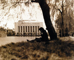 Japanese civilian at a park, Tokyo, Japan, Oct 1945; note Dai-Ichi Seimei Building in background