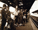 Demobilized Japanese soldiers and civilians at a rail station, Japan, Sep 1945
