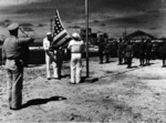 US flag raising at Maloelap Atoll, Marshall Islands, Sep 1945; note Captain H. B. Grow at left and Japanese officers at right