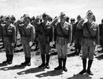 Japanese officers and men saluting the US flag, Maloelap, Marshall Islands, Sep 1945