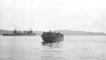 Elco 80-foot torpedo boat PT-109 commanded by Ensign Bryant L Larson delivering 96 survivors from the sunken cruiser USS Northampton to Tulagi Harbor, Solomon Islands, 1 Dec 1942. Note the cruiser USS New Orleans at left.